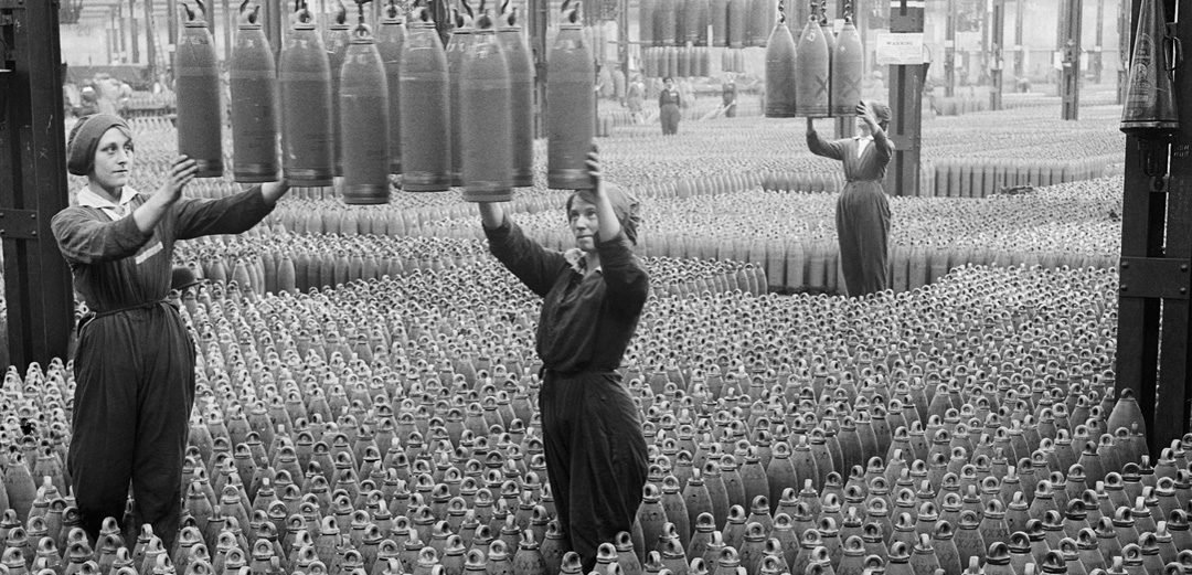 Female munitions workers arrange shells
