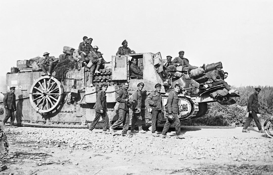 A British gun carrier tank and soldiers